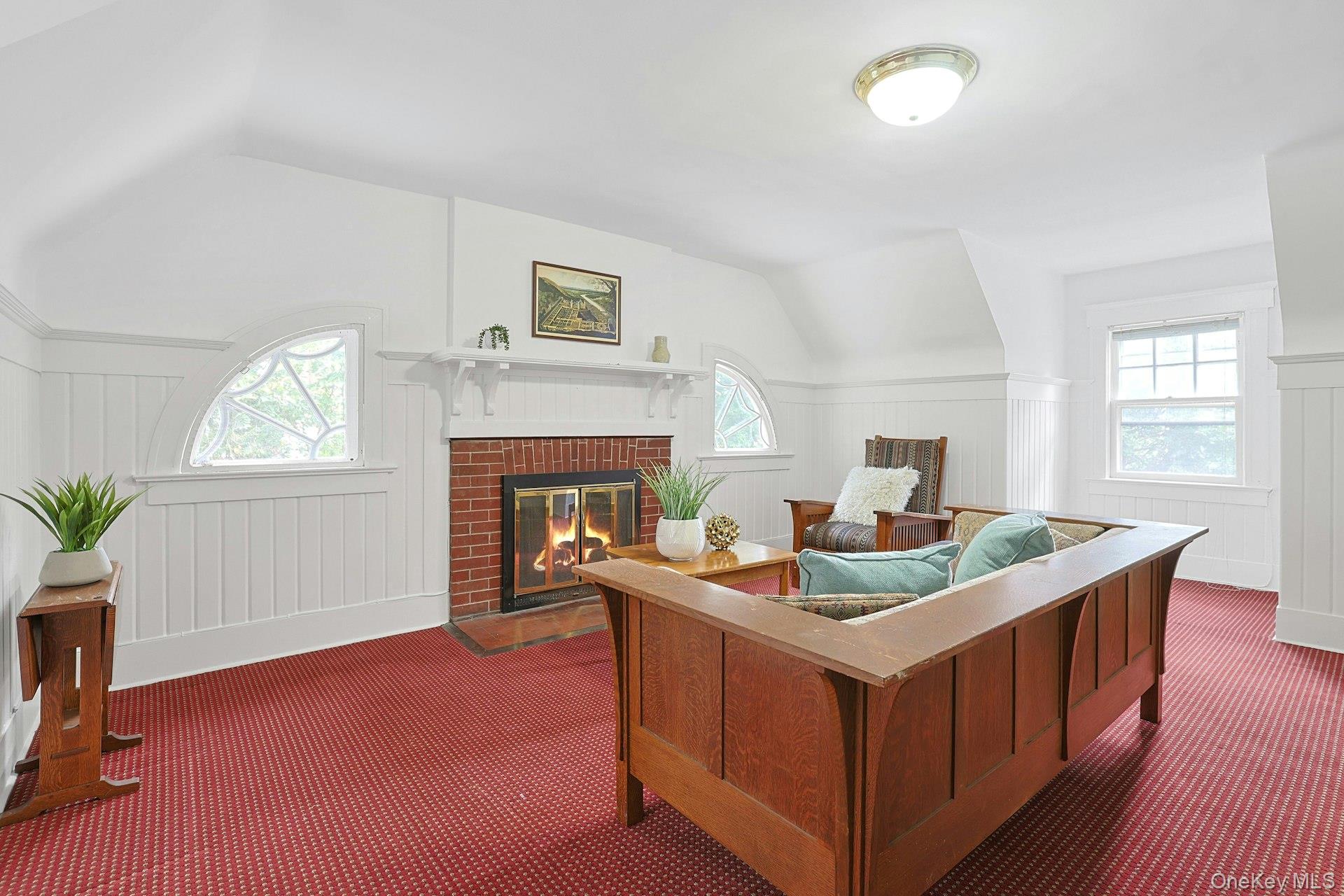 49 Overlook Circle New Rochelle, NY 10804 - Photo 35 of 47 a living room with stainless steel appliances kitchen island a table chairs in it and a fireplace