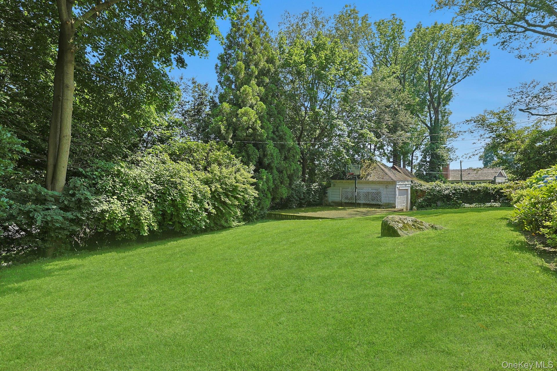 49 Overlook Circle New Rochelle, NY 10804 - Photo 4 of 47 a view of a backyard with a small house