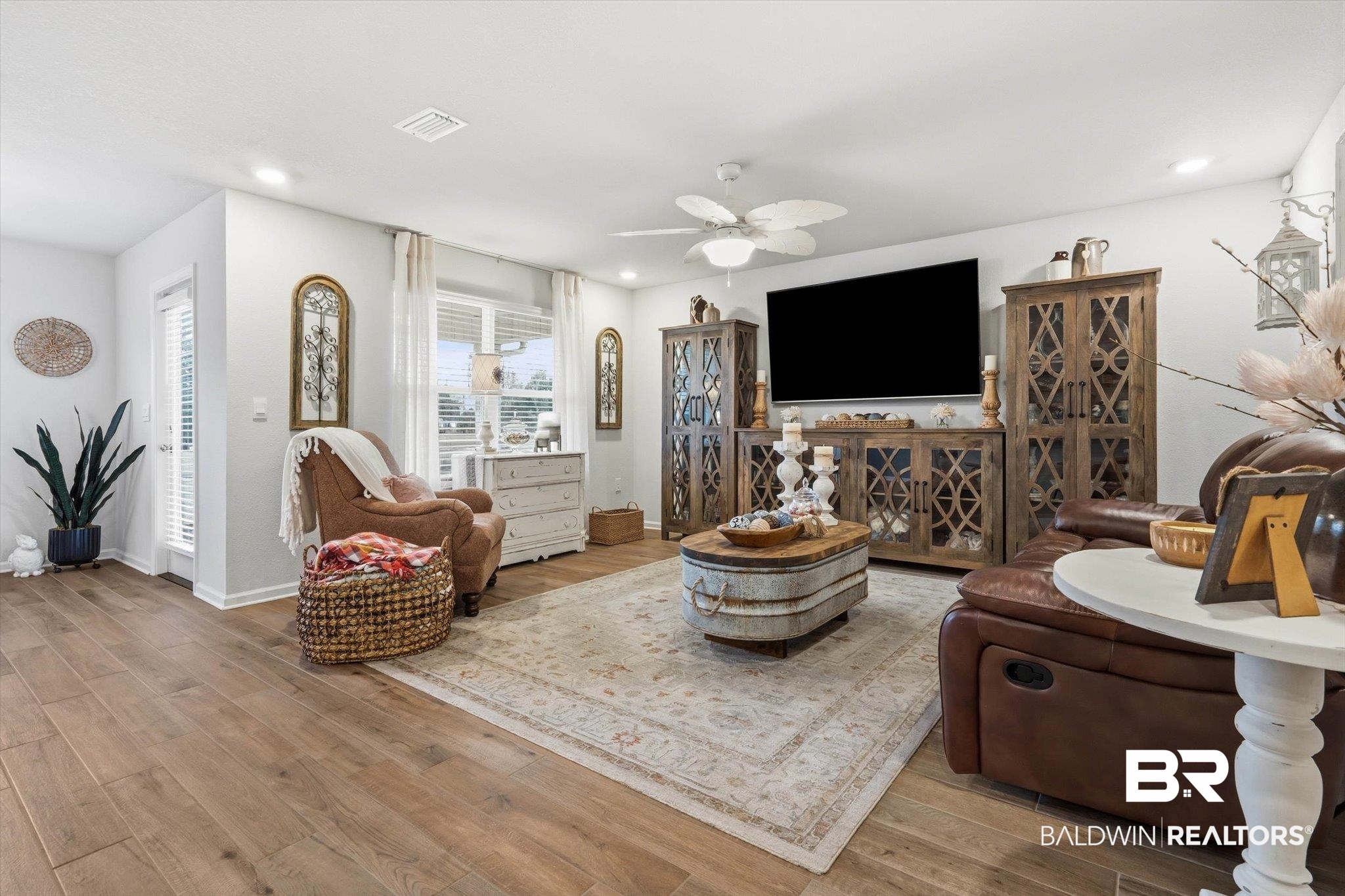 17041 Muse Street Loxley, AL 36551 - Photo 3 of 44 Living area featuring hardwood / wood-style floors and a ceiling fan