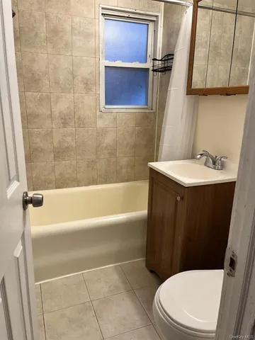 a bathroom with a sink a toilet and bathtub