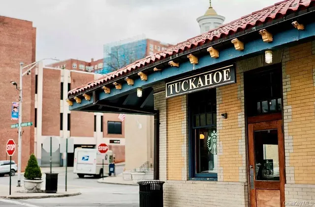 a front view of a building with parking