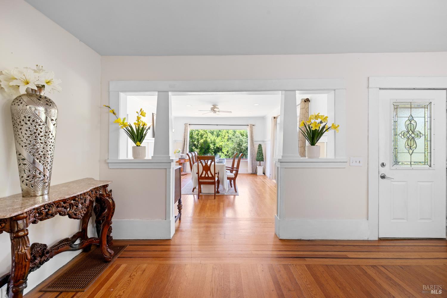 1194 Felta Road Healdsburg, CA 95448 - Photo 19 of 52 a view of a dining room with furniture a potted plant and wooden floor