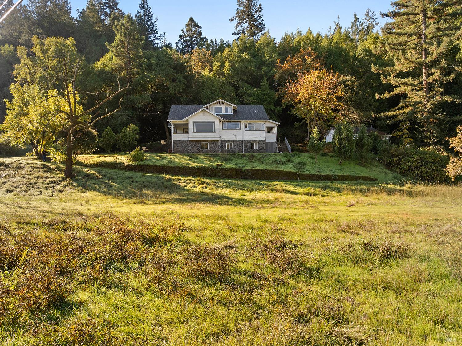 1194 Felta Road Healdsburg, CA 95448 - Photo 2 of 52 a view of a swimming pool with a yard and trees