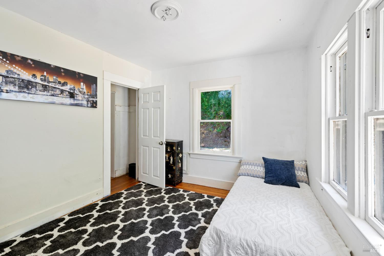 1194 Felta Road Healdsburg, CA 95448 - Photo 31 of 52 a bedroom with a bed and wooden floor