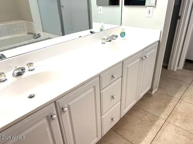 a bathroom with a sink and mirror