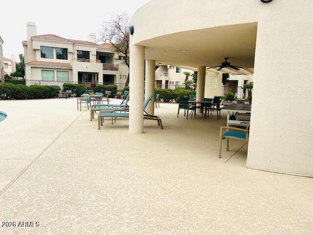 8270 North Hayden Road, Unit 1042 Scottsdale, AZ 85258 - Photo 7 of 30 a view of a patio with dining table and chairs