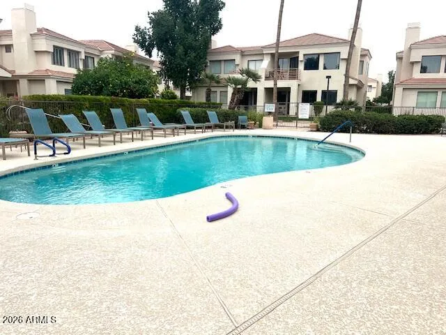 a view of a swimming pool with a yard