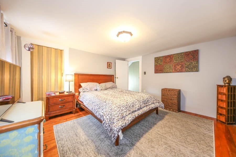 4 Riverview Place Lawrence, MA 01841 - Photo 15 of 21 a bedroom with a bed and a couch