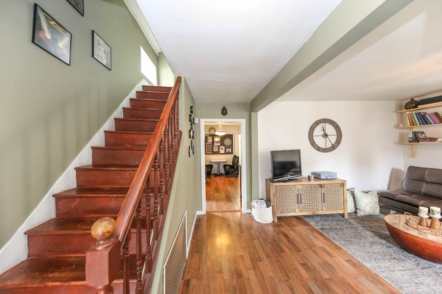 4 Riverview Place Lawrence, MA 01841 - Photo 4 of 21 a view of a livingroom with wooden floor and flat screen tv