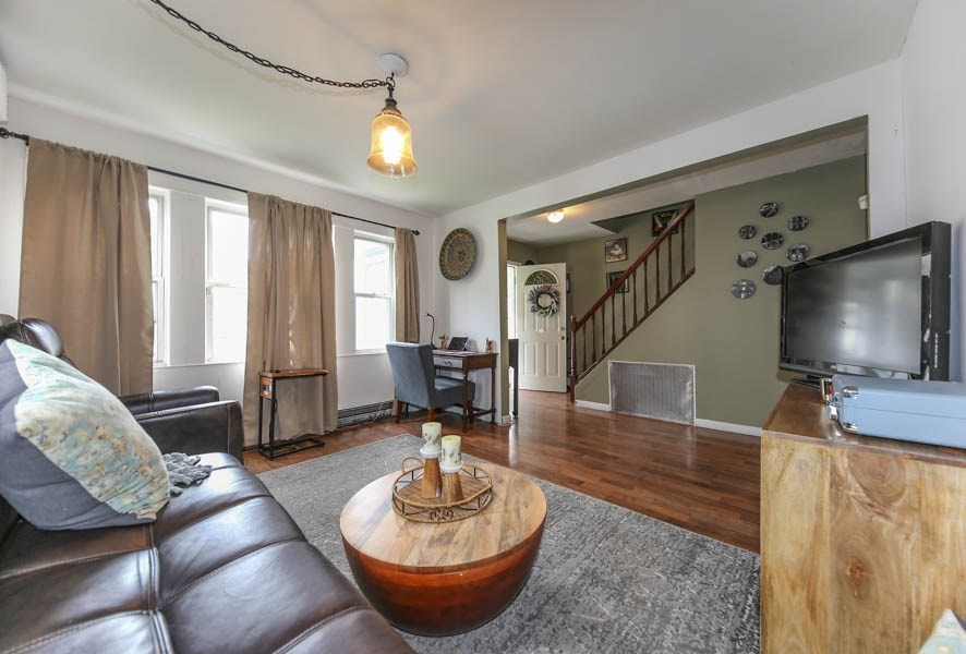 4 Riverview Place Lawrence, MA 01841 - Photo 6 of 21 a living room with furniture and a flat screen tv