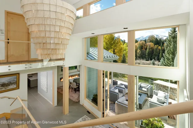 a view of a living room and entry way