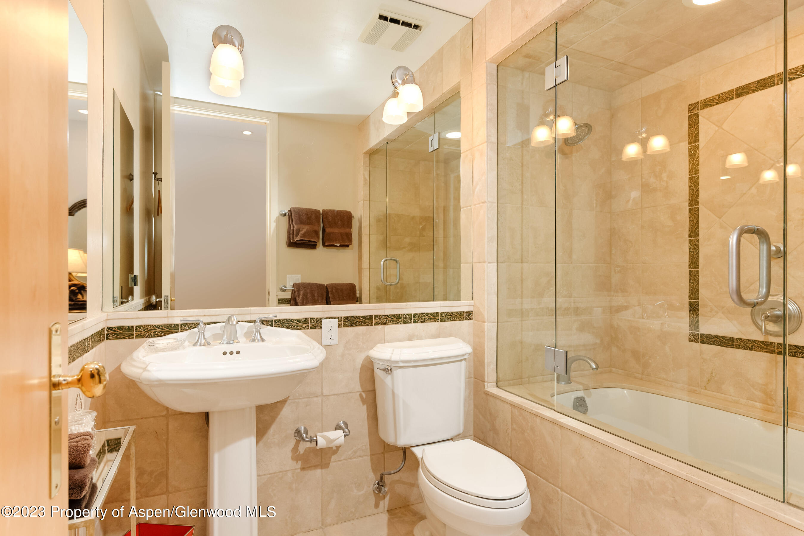 58 Pitkin Way Aspen, CO 81611 - Photo 24 of 33 a bathroom with a sink a toilet a mirror and bathtub