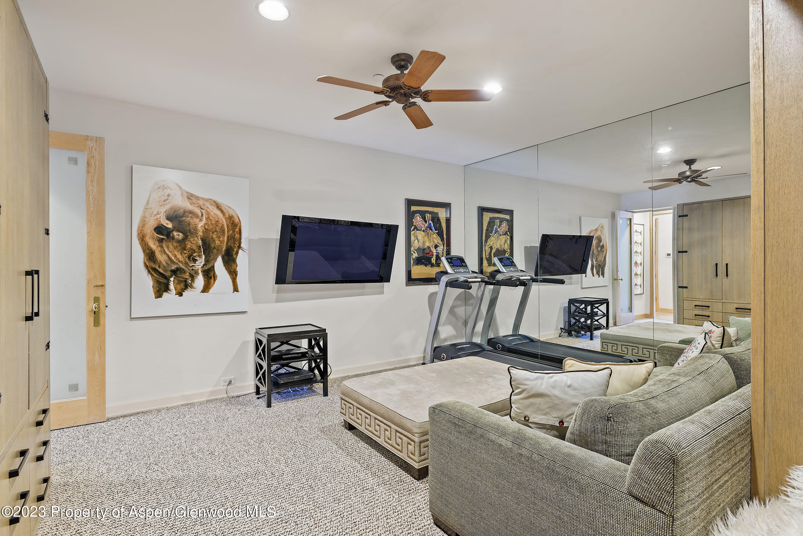 58 Pitkin Way Aspen, CO 81611 - Photo 25 of 33 a living room with furniture and a flat screen tv