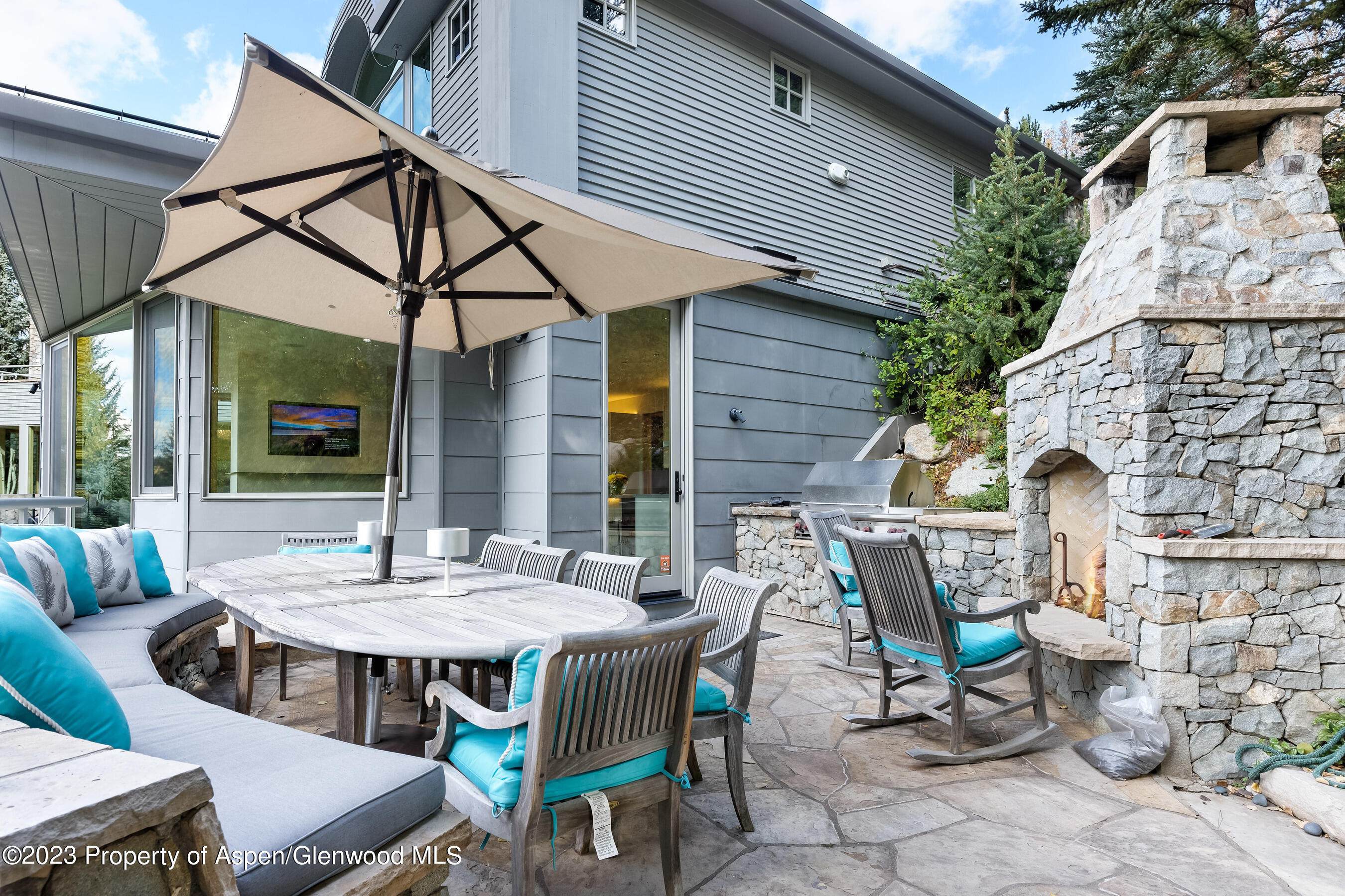 58 Pitkin Way Aspen, CO 81611 - Photo 28 of 33 a view of a patio with table and chairs and potted plants