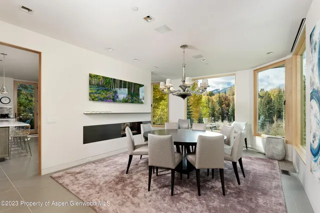 a view of a dining room with furniture window and outside view