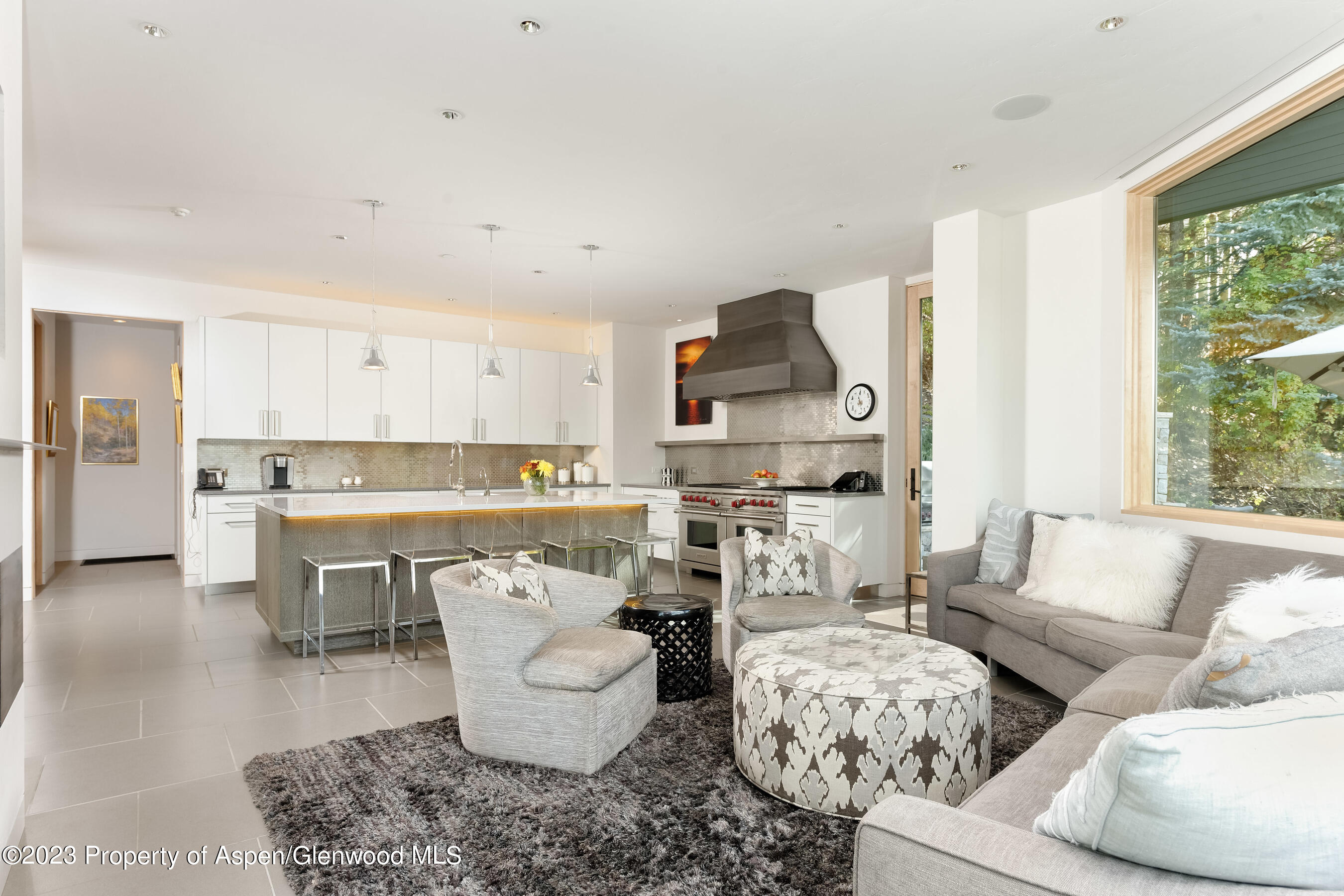 58 Pitkin Way Aspen, CO 81611 - Photo 7 of 33 a living room with furniture and a large window