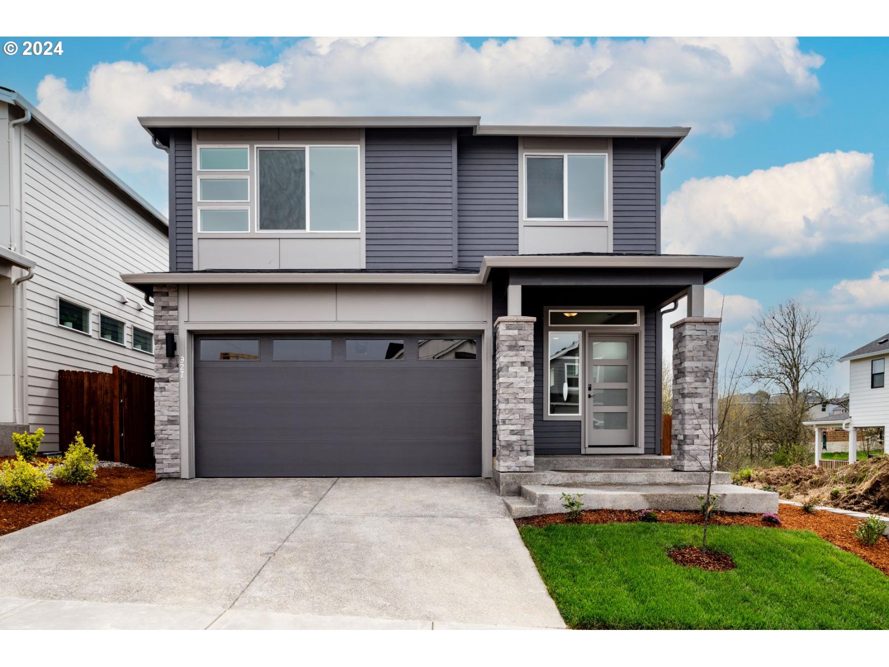 927 Northwest 178th Street Ridgefield, WA 98642 - Photo 1 of 18 a front view of a house with a yard