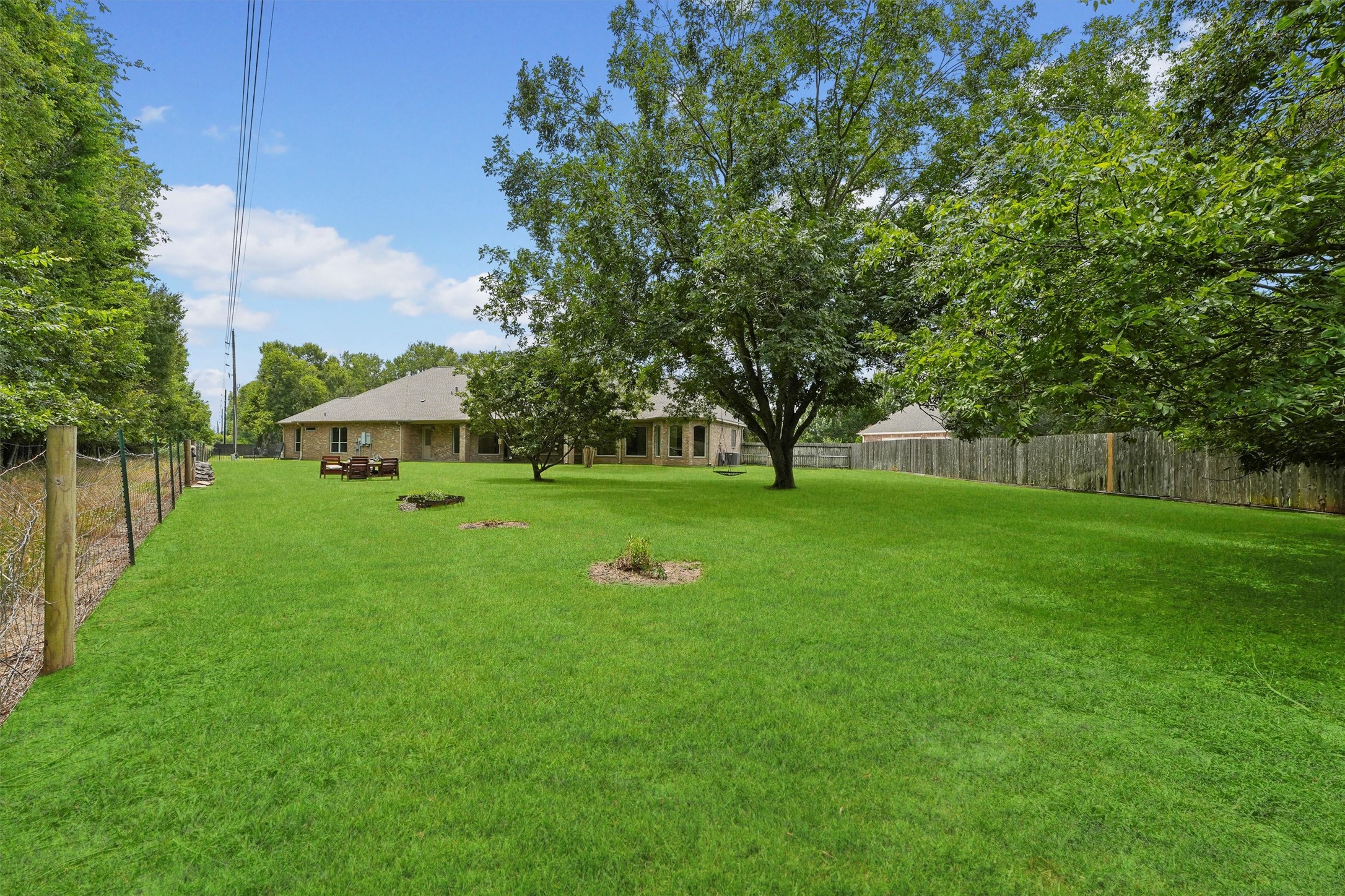 4102 Worthing Drive Fulshear, TX 77441 - Photo 23 of 30 a view of green field with tree in the background