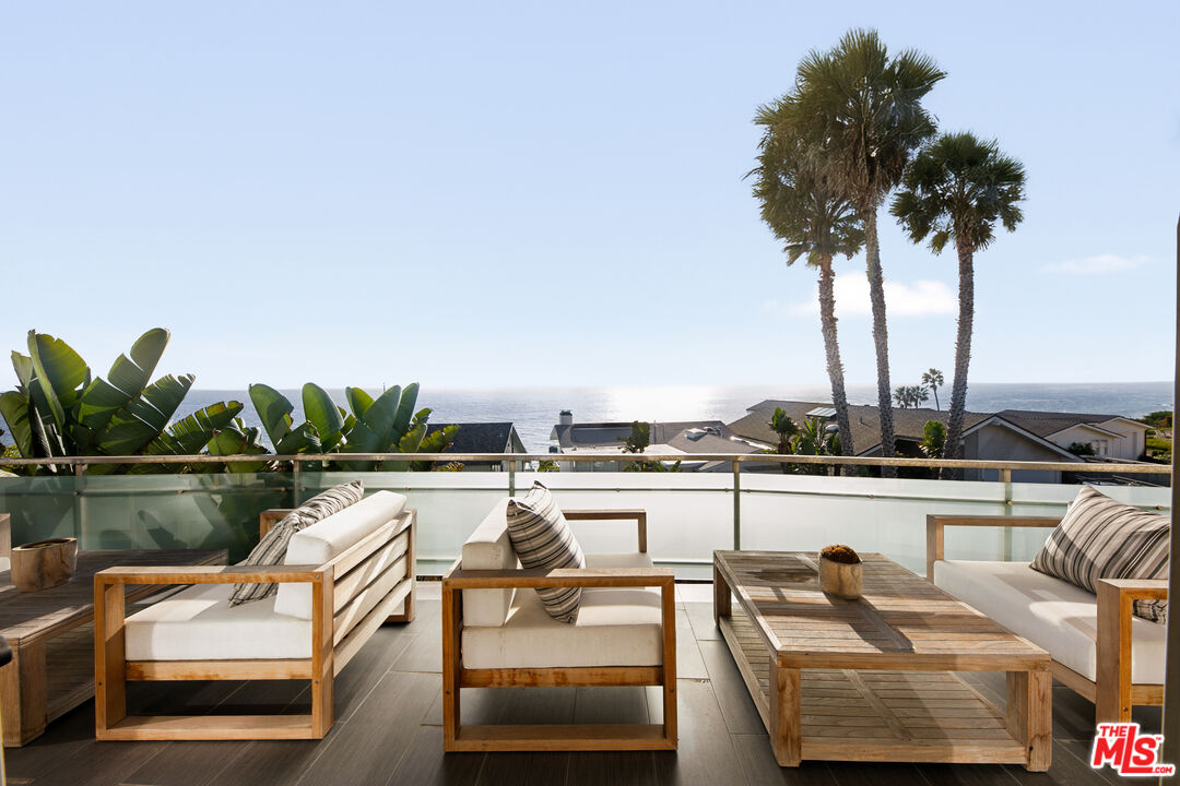 31558 Victoria Point Road Malibu, CA 90265 - Photo 20 of 55 a view of a swimming pool with lounge chairs