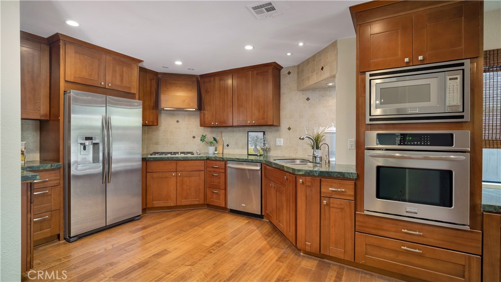 57 Pinewood Irvine, CA 92604 - Photo 17 of 39 Elegant Cherry cabinets