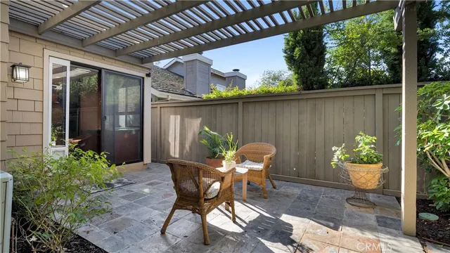 a patio with table and chairs