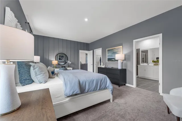 a bedroom with a bed and a view of bathroom