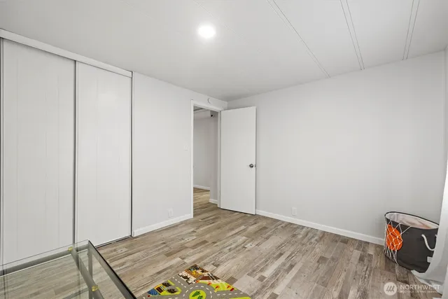 a view of room with wooden floor