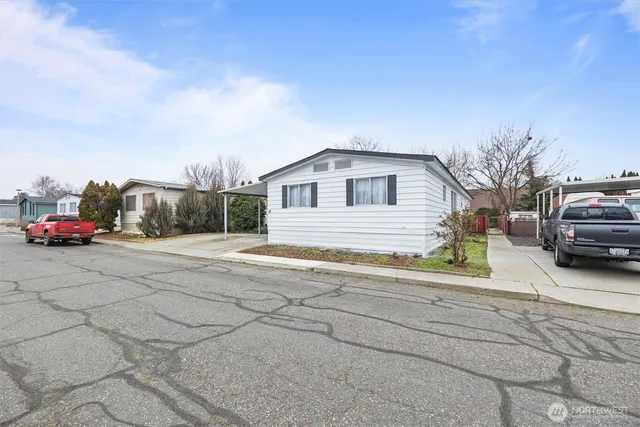 a view of a car parked in front of a house