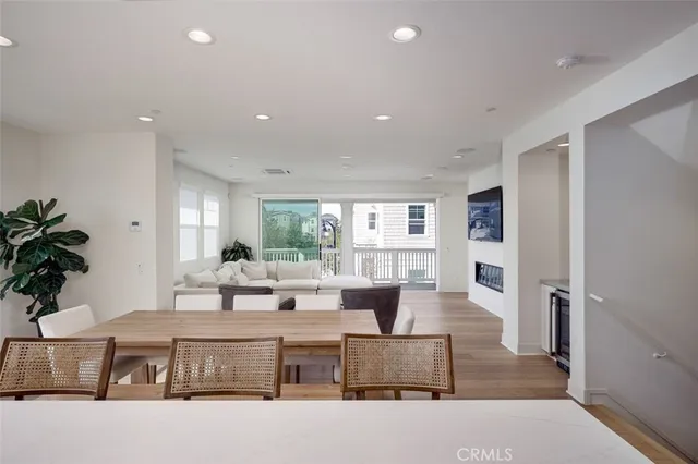a living room with furniture potted plant and a window