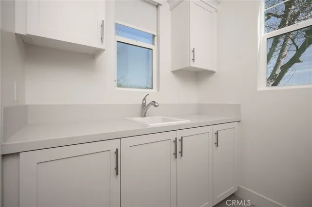 a bathroom with a sink and mirror