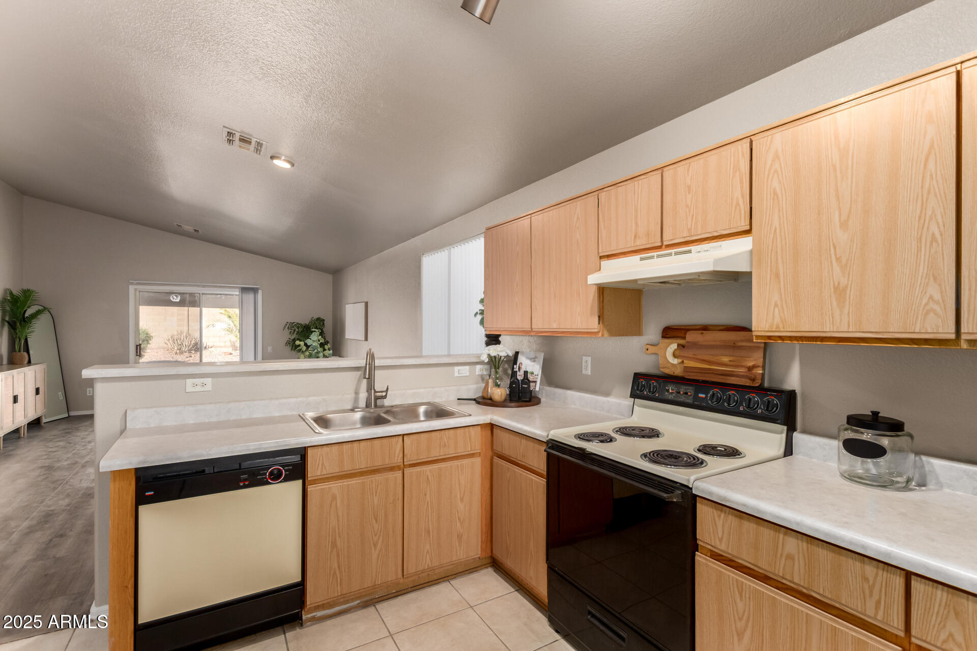 1752 West Renaissance Avenue Apache Junction, AZ 85120 - Photo 14 of 29 a kitchen with a sink stove and cabinets
