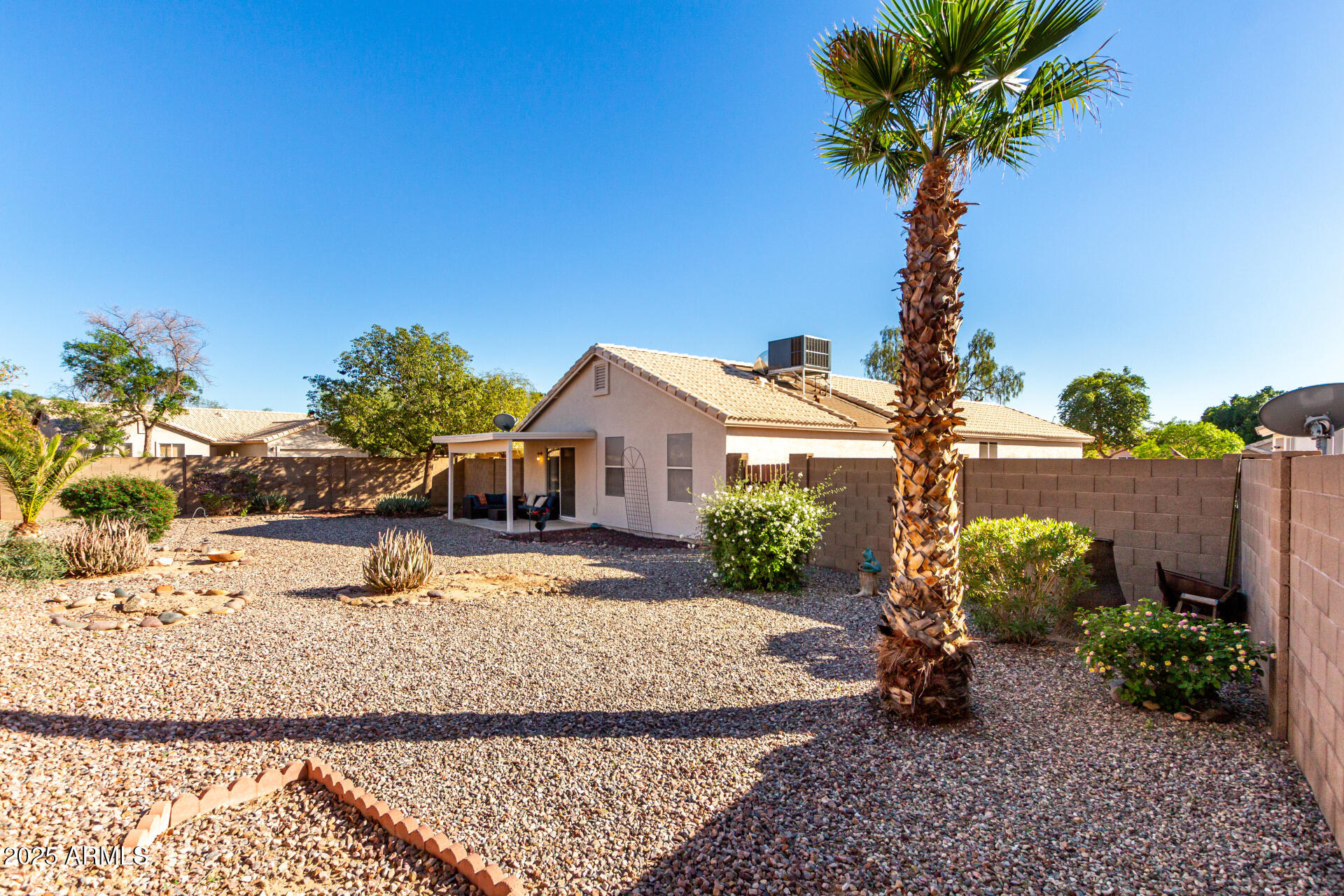 1752 West Renaissance Avenue Apache Junction, AZ 85120 - Photo 24 of 29 a front view of a house with a yard and garage