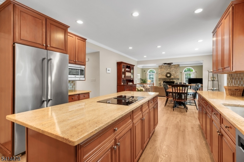 33 St Nickolas Way Bernards, NJ 07920 - Photo 16 of 50 a kitchen with stainless steel appliances granite countertop table chairs sink and cabinets