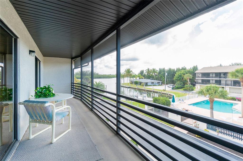 2767 North Beach Road, Unit 207 Englewood, FL 34223 - Photo 1 of 1 Screened balcony overlooking Pool and Bay