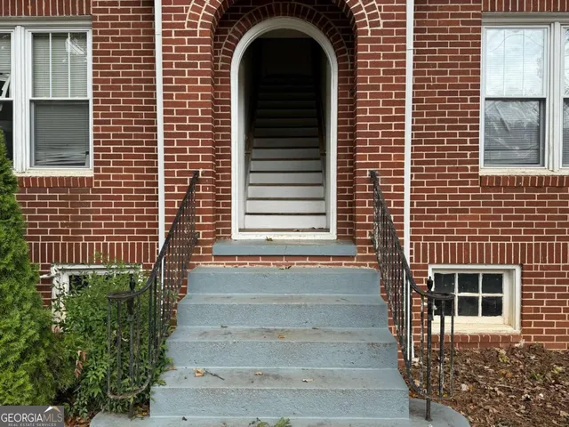 a front view of a house with a garage