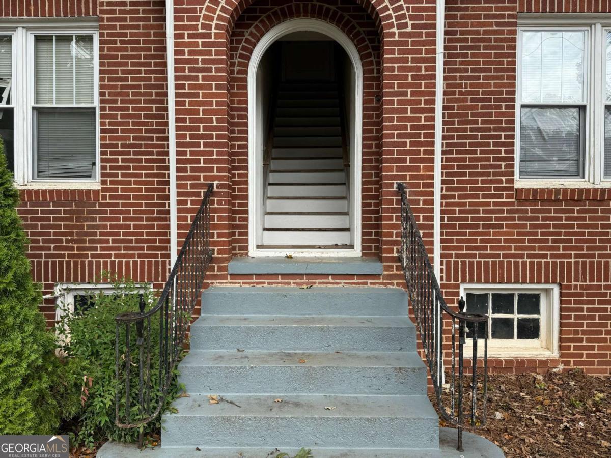 300 Forrest Avenue, Unit B Gainesville, GA 30501 - Photo 2 of 11 a front view of a house with a garage