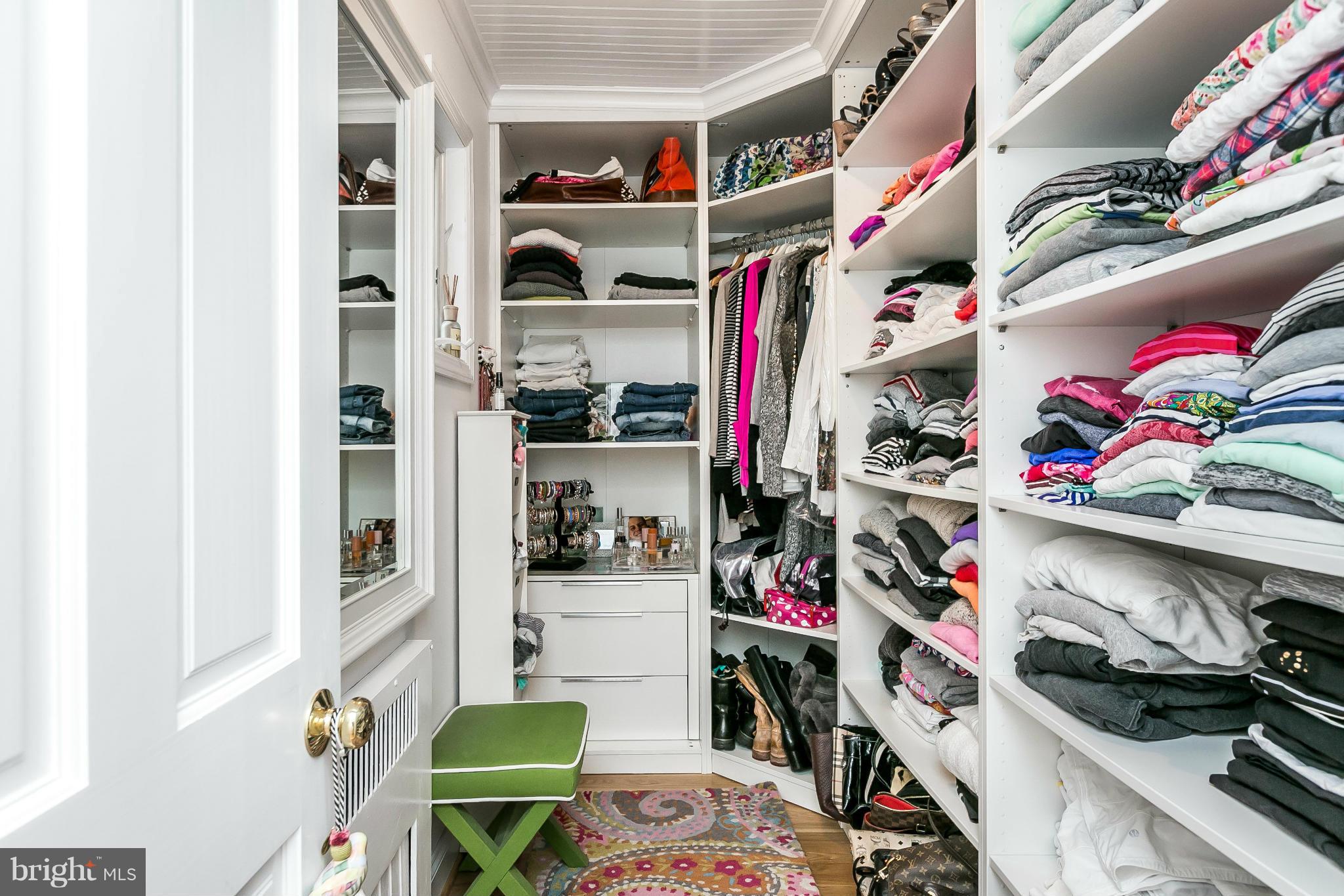 5700 Kenmore Road Baltimore, MD 21210 - Photo 18 of 30 a view of walk in closet with clothes and shoes