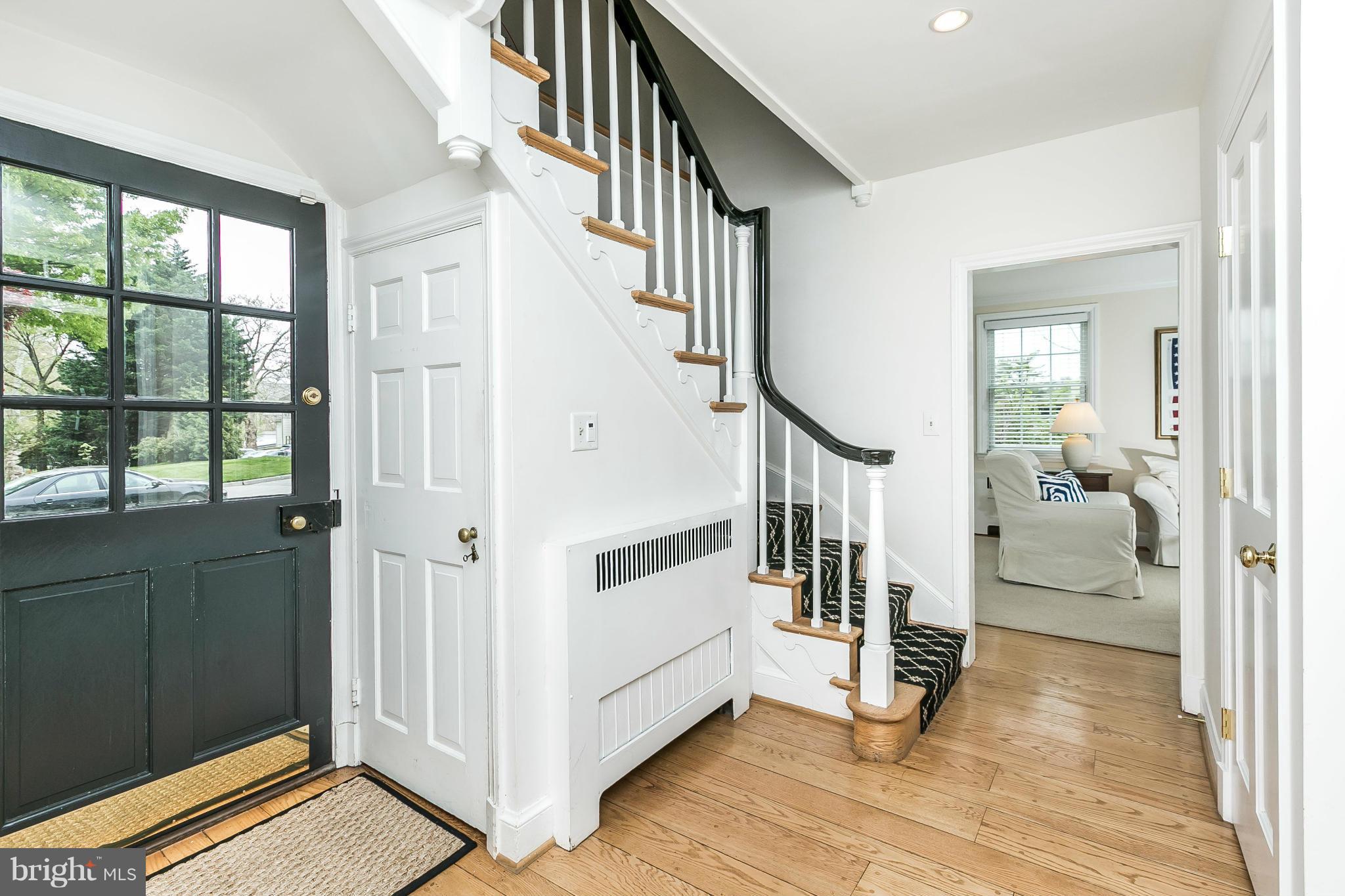 5700 Kenmore Road Baltimore, MD 21210 - Photo 3 of 30 a view of an entryway with wooden floor and windows