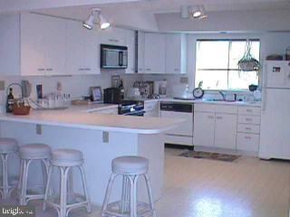 19 Rabbit Run Lane Ocean Pines, MD 21811 - Photo 3 of 4 a kitchen with a sink cabinets and window