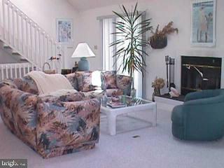 19 Rabbit Run Lane Ocean Pines, MD 21811 - Photo 4 of 4 a living room with furniture and a fireplace