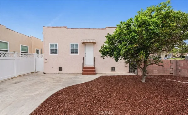 a view of a house with a tree