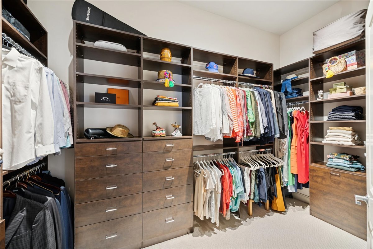 30 West Erie Street, Unit 601 Chicago, IL 60654 - Photo 21 of 30 a view of walk in closet with clothes and shoes