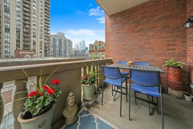 30 West Erie Street, Unit 601 Chicago, IL 60654 - Photo 4 of 30 a view of a chairs and table in the patio