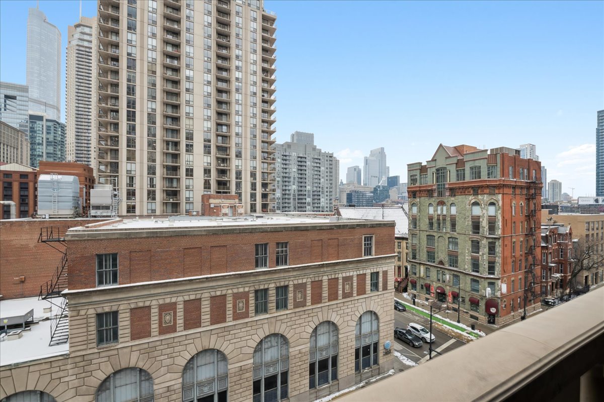 30 West Erie Street, Unit 601 Chicago, IL 60654 - Photo 5 of 30 a view of a building from a balcony