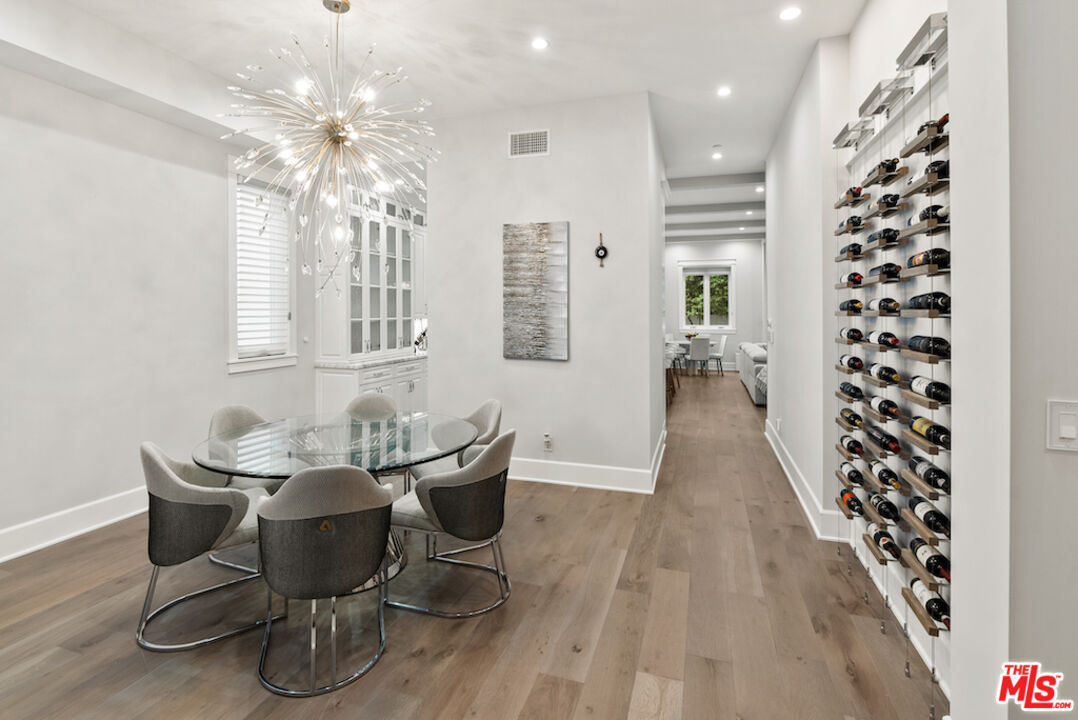 592 30th Street Manhattan Beach, CA 90266 - Photo 22 of 57 a view of a dining room with furniture and chandelier