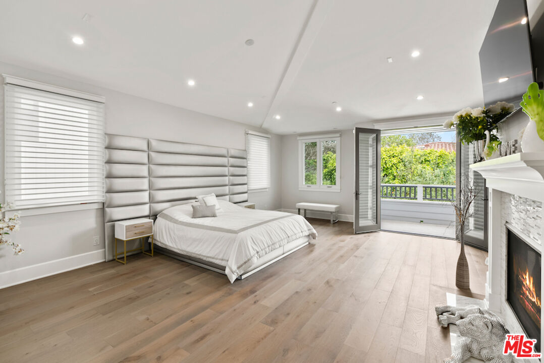 592 30th Street Manhattan Beach, CA 90266 - Photo 26 of 57 a spacious bedroom with a large bed and a large window