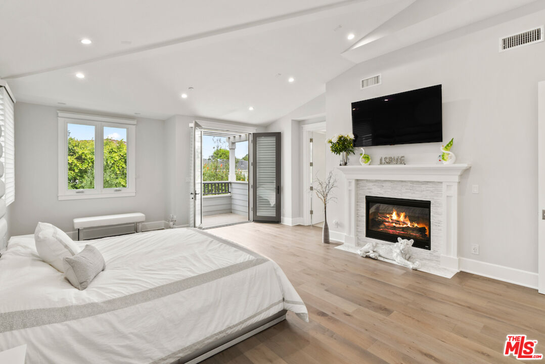 592 30th Street Manhattan Beach, CA 90266 - Photo 27 of 57 a bedroom with a bed and a flat screen tv