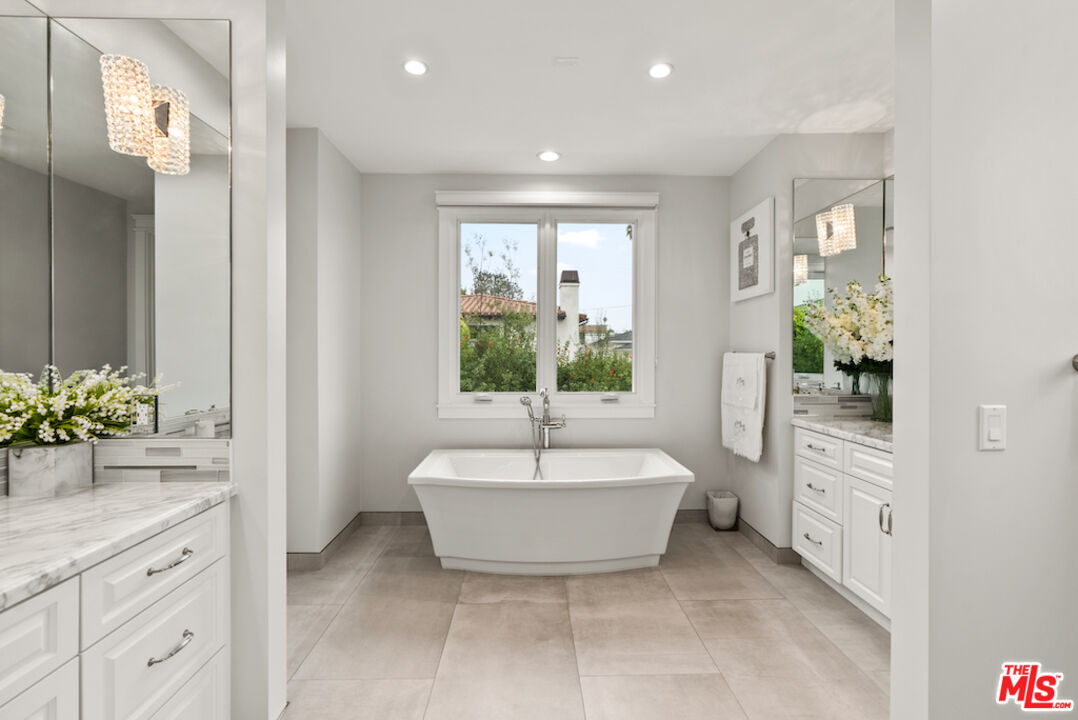 592 30th Street Manhattan Beach, CA 90266 - Photo 30 of 57 a spacious bathroom with a bathtub and sink