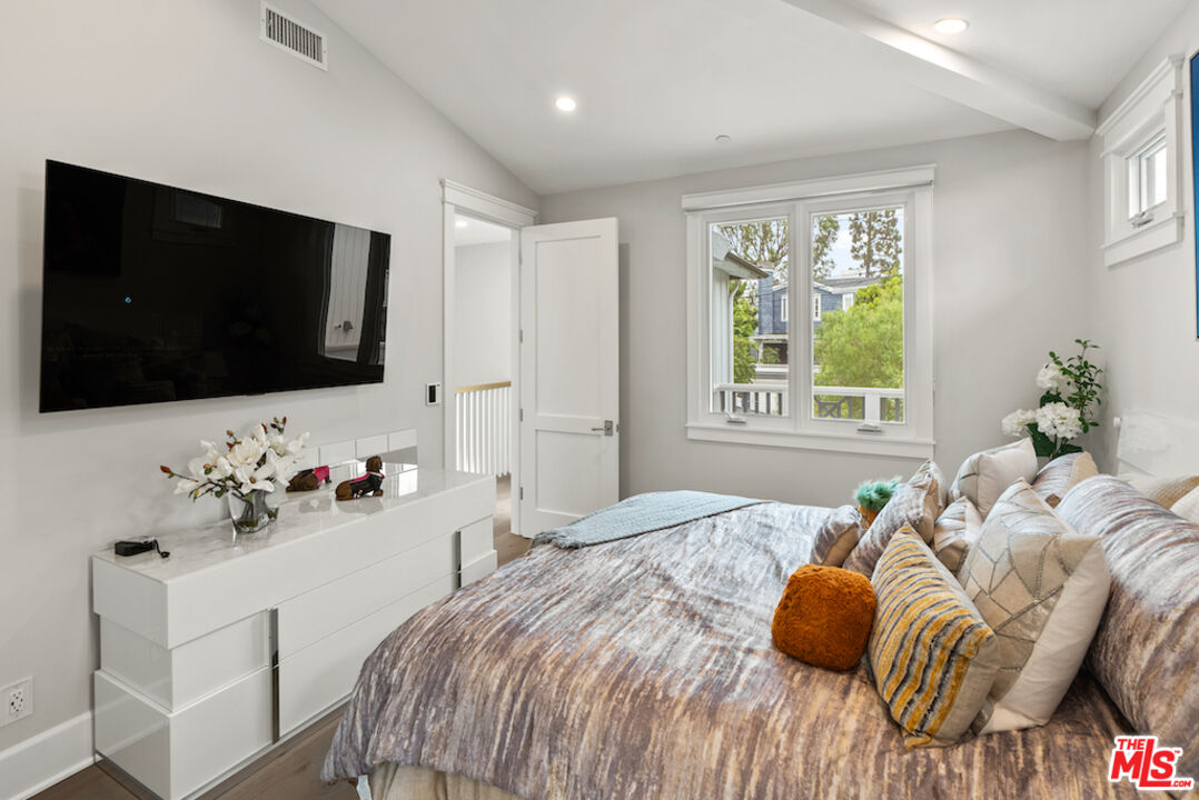 592 30th Street Manhattan Beach, CA 90266 - Photo 37 of 57 a bedroom with a bed and a flat screen tv