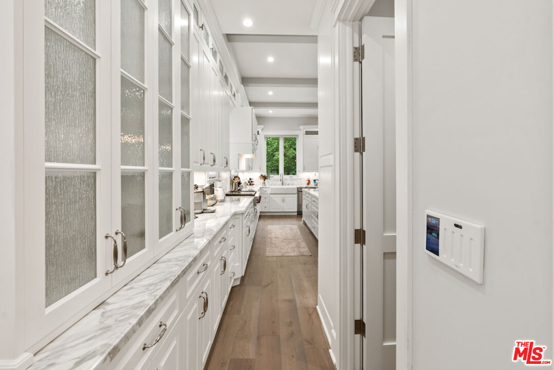 592 30th Street Manhattan Beach, CA 90266 - Photo 40 of 57 a view of a hallway with wooden floor and staircase